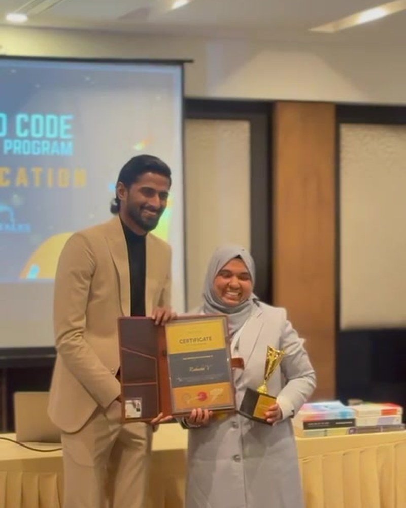 Rabeeba Vellangara receiving a certificate of recognition at the Guided Code convocation